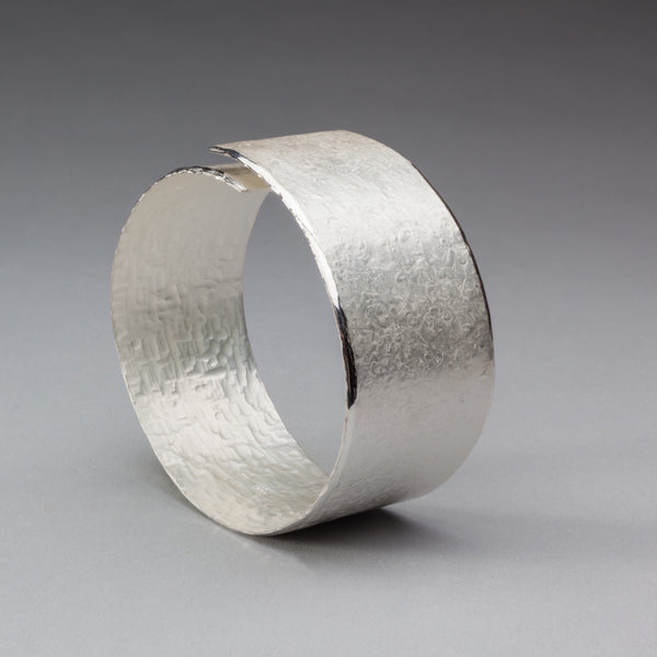 Textured silver overlap 'open' bangle